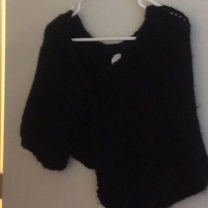 A short never worn knitted poncho